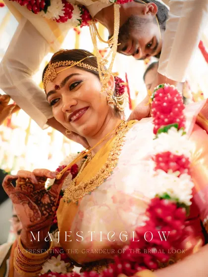 A stunning close-up of the South Indian bride, her face glowing with happiness during the wedding ceremony.