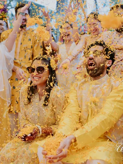 Another angle of the joyous flower shower, capturing the excitement of the guests.
