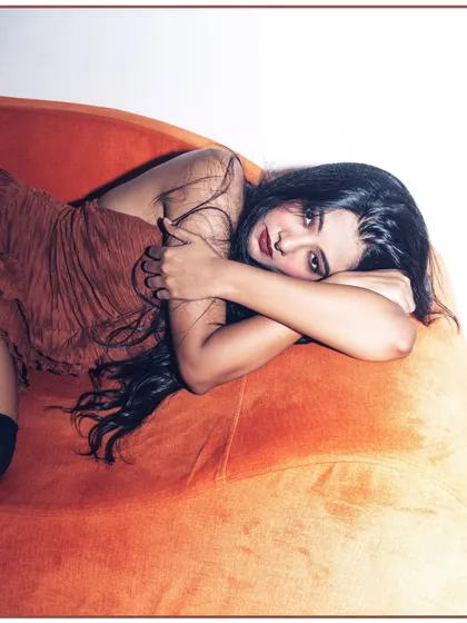 An intimate and moody close-up on the couch. This adds an emotional layer to a commercial lookbook.