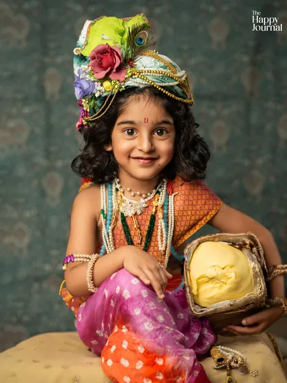 A duplicate of image 38, featuring a charming little Krishna with a pot of butter and a sweet, knowing smile.