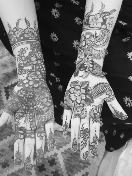 A designer mehndi for a client, shown here in black and white to highlight the intricate patterns and line work.
