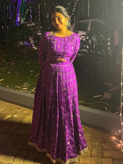Our beautiful client rocking the sangeet dance floor in this purple bandhini dress. It's a full-length gown that is both traditional and modern.
