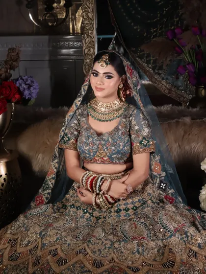 A full seated portrait showing the bride looking confident and beautiful, the ultimate goal of any bridal makeover.