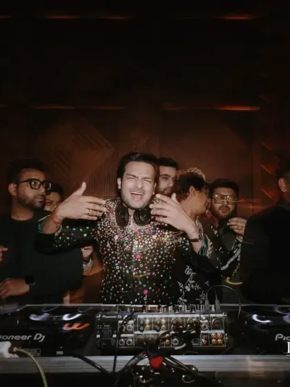 The groom takes the DJ console at the Arabian Sufi Night. The moody, warm lighting and intricate patterns in the decor helped create a rich, cinematic, and soulful ambiance.
