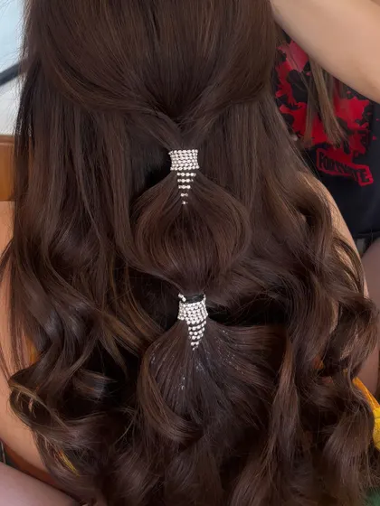 A closer look at the crystal cuffs on the bubble ponytail. I teach how to create this voluminous, sectioned look and how to choose the right accessories to elevate it.