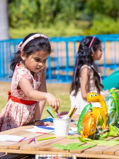 A dinosaur-themed coloring station, providing a creative and calmer activity for the little guests.