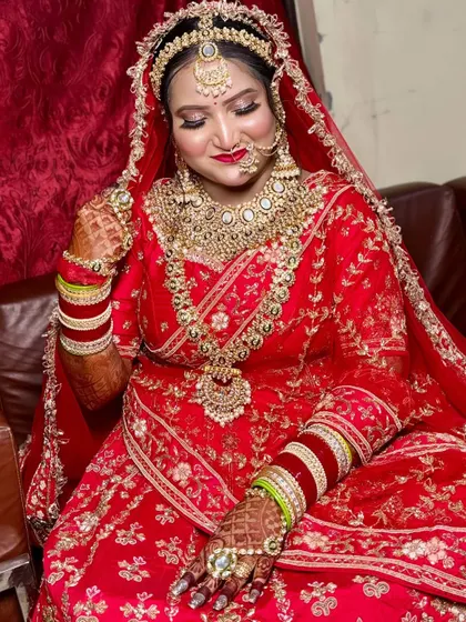 Another angle of this royal bride, capturing the richness of her attire and the flawless finish of her HD makeup.