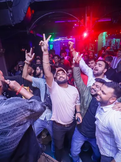 This is me in my element, moving through the crowd at a high-energy club night. My job is to get close to the janta, feel their energy, and turn it up to the max, making sure not a single person is left standing still.