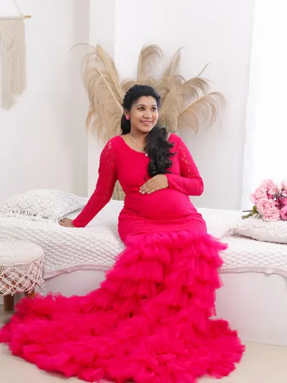 A relaxed and happy portrait in our boho studio, the vibrant pink gown adding a beautiful pop of color.