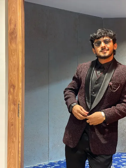 Another angle of the maroon jacquard suit, showing its versatility and modern fit. A great addition to any man's formal wardrobe.