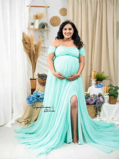 This is the same beautiful gown, capturing the mother's happy and radiant expression.