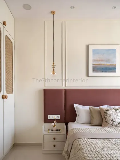 This angle showcases the custom wardrobe with real cane sandwiched between toughened glass. The wooden handles on the side table and wardrobe create a cohesive and harmonious look.