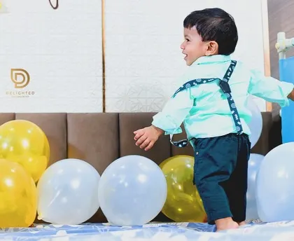 The simple joy of a toddler playing with balloons. My candid photography style aims to capture your child's personality as they explore and have fun.