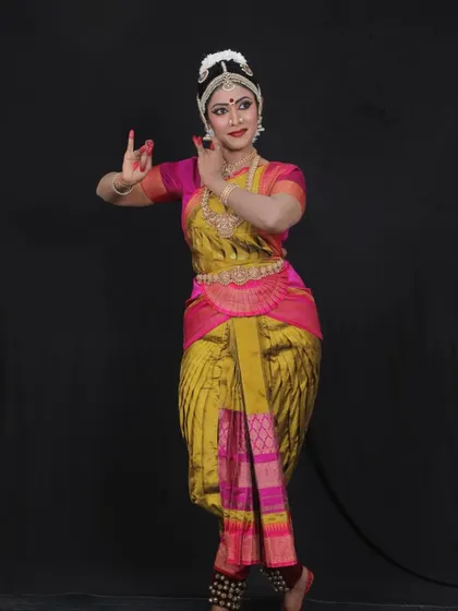 Brinda looking lovely in her costume for her Arangetram. The choice of color and design for the saree is a collaborative process to ensure it complements the dancer perfectly.