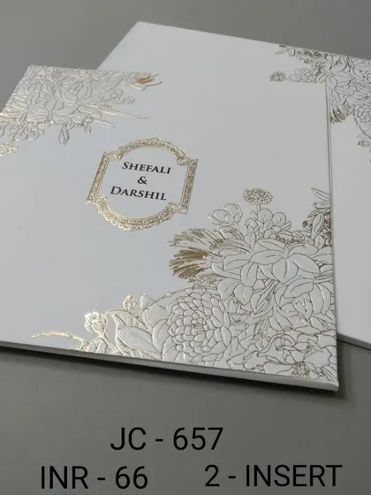 This minimalist white card is elevated by a beautiful gold foil floral pattern. It's a modern and chic design that is both simple and luxurious.