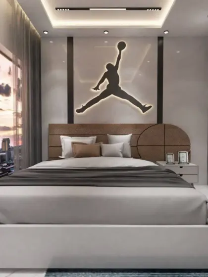The centerpiece of this room is the custom headboard with an illuminated Air Jordan logo, perfect for a basketball fan. We love creating personalized spaces that reflect your passions.