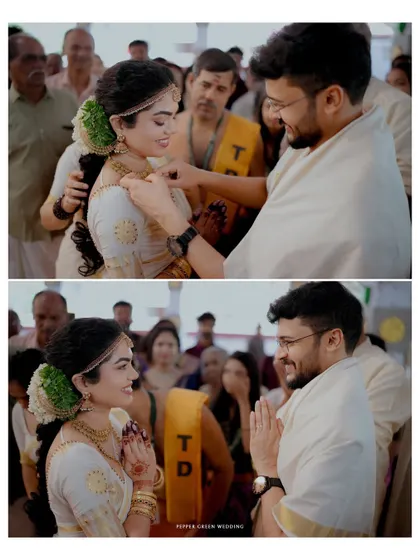 The sacred moment of the groom tying the thali around the bride's neck, a pivotal ritual in a Hindu wedding ceremony.