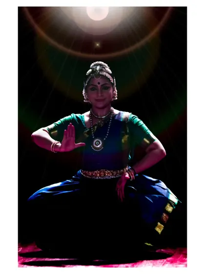 A striking image of Chaitra Rao under a spotlight, emphasizing the dramatic potential of a solo performance.