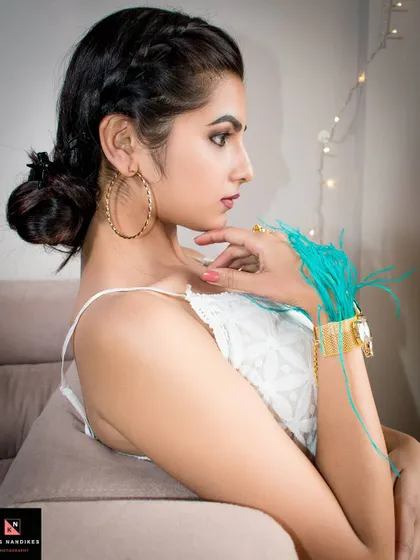 A profile shot from the 'Stay Home' series. The model's elegant hairstyle and thoughtful expression are highlighted by the soft lighting, creating a calm and beautiful portrait.