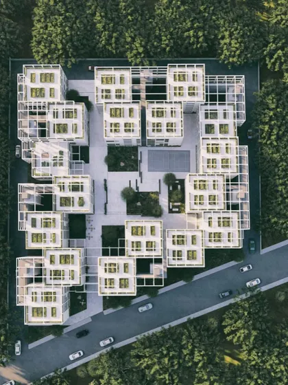 The geometric purity of the Pixel Housing masterplan is evident in this aerial view, showing a perfect balance between built form and open space.