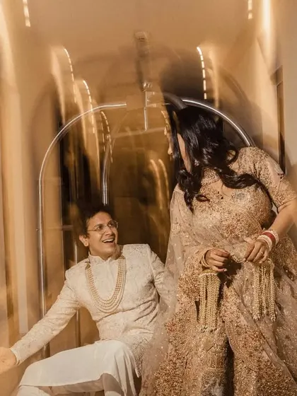 Another motion-blur shot from the hallway series, capturing the dynamic energy and laughter between the couple.