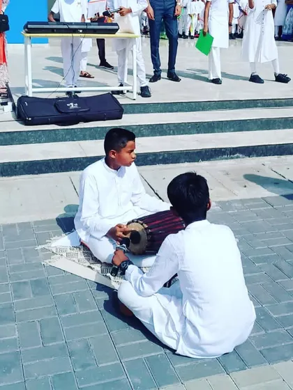 Two of our students performing on traditional percussion instruments during the Independence Day event. We embrace and teach a wide variety of musical styles and instruments.