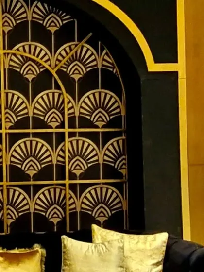 A detail of the custom black and gold Art Deco panel.