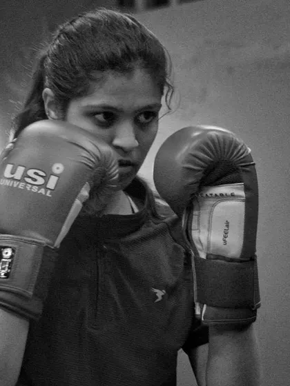 Guard up, eyes forward. This is the fundamental defensive posture we instill in every boxer.