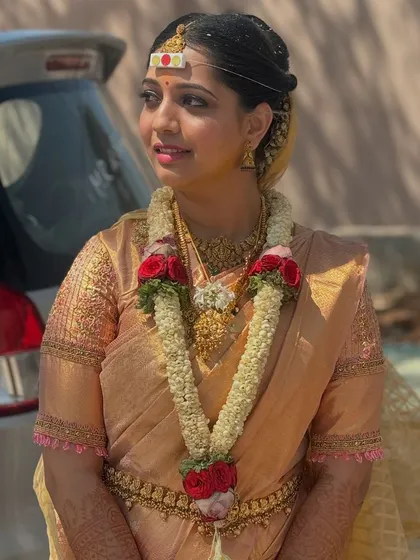 A candid moment of my best friend on her wedding day. I had the honor of draping her saree for the muhurtham, ensuring every detail was perfect for her special moment.