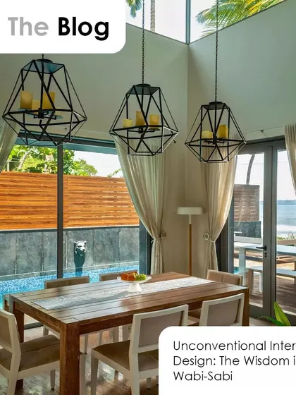 An insight from our blog on the Wabi-Sabi design philosophy. This dining room, with its natural wood table and view of the pool, embodies the beauty of simplicity and imperfection.