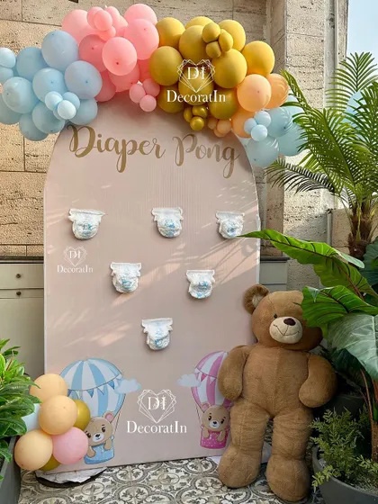 A "Diaper Pong" game station for a teddy bear and hot air balloon-themed shower.