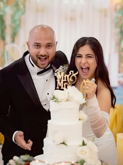 Pure fun at the cake cutting. This couple's energy is amazing, and her simple, elegant look was perfect for a day of celebration.