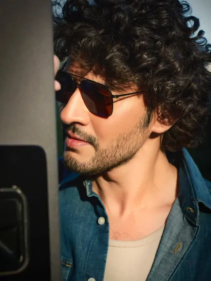 Another angle from the golden hour shoot with Mahesh Babu. The profile view and the soft light create a thoughtful and classic portrait, emphasizing his strong features.