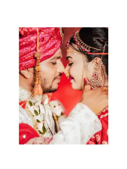 An intimate close-up of a couple, nose-to-nose, capturing the intensity and romance of their connection on their wedding day.