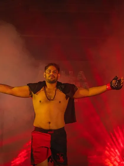 The walkout. A fighter enters the arena, ready for battle. The smoke, the lights, and the crowd are all part of the spectacle, but inside, there is only focus.