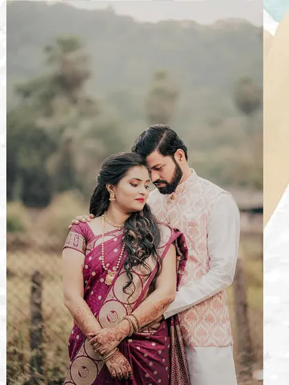 A quiet, romantic portrait of the engaged couple in an outdoor setting. Their traditional outfits and the natural background create a timeless and serene image.