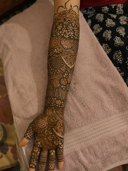 Another angle of the engagement bridal henna, showing the full arm coverage.