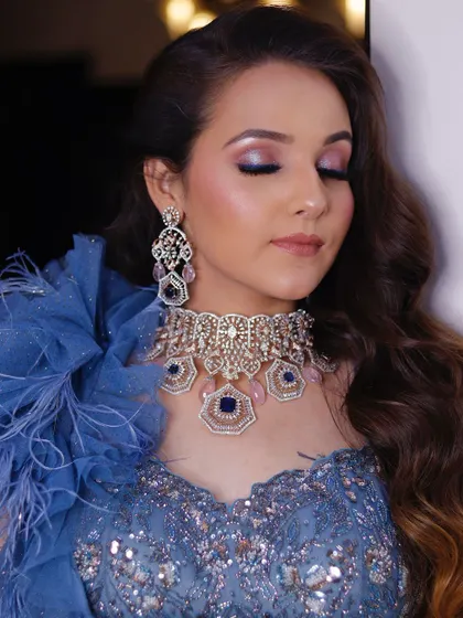 Another angle of the dreamy blue and pink eye makeup. The shimmer catches the light beautifully, making it a perfect choice for an evening event.