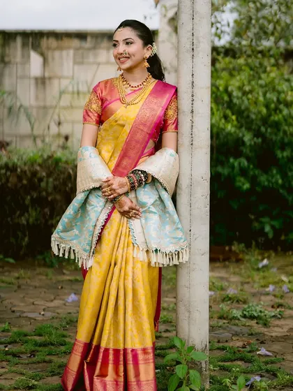 A full-length portrait showcasing the complete bridal attire. The makeup remains fresh and radiant even from a distance, proving that a good base is key. The look is traditional, graceful, and perfect for a wedding album.