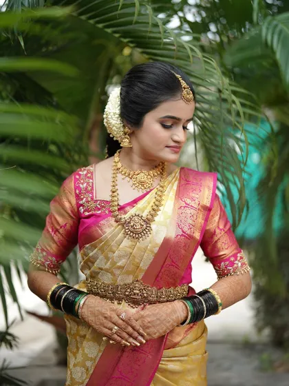 A gentle, downward glance captures the beautiful eye makeup and the intricate details of her jewelry.