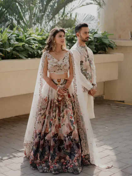 Stepping into a carnival of colors with style and grace! This daytime look features soft, natural makeup that lets her vibrant floral lehenga be the star.