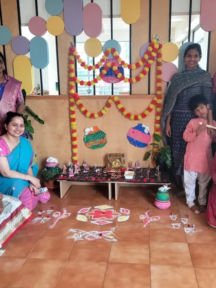 Our beautiful Janmashtami setup, complete with rangoli, decorations, and a display of Krishna's stories, created with the help of our children and staff.
