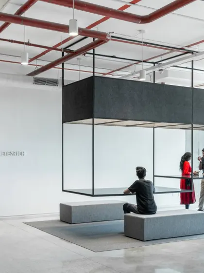 In our design for Netenrich, we created this minimalist structural installation as a focal point for informal interaction. The open, skeletal form provides a sense of place without closing off the space, encouraging spontaneous collaboration in a grounded and honest environment.