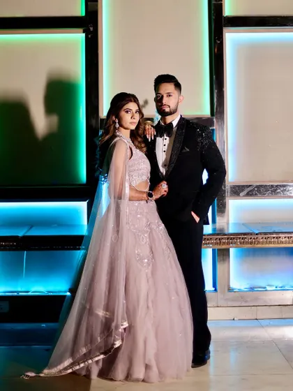 A full-length view of our embellished tuxedo, showing how it creates a sharp and sophisticated silhouette. Paired with a classic bow tie, this look is crafted to own the night at any formal event or wedding reception.