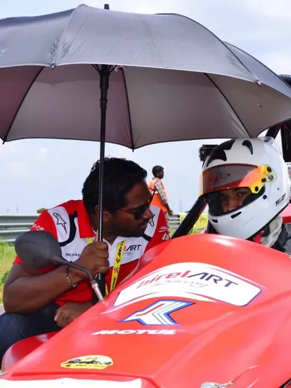 A moment of pre-race strategy discussion between our driver and a team member. This one-on-one coaching is integral to our arrive and drive service.