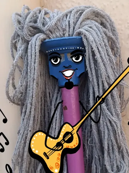 A creative concept showing how a brand mascot can be born from an unconventional idea. This character, made from a mop, is designed to be quirky, musical, and unforgettable.