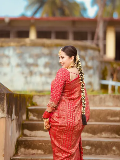 Our bride Iva in a stunning red brocade saree for one of her wedding ceremonies. A classic and timeless choice for any bride.