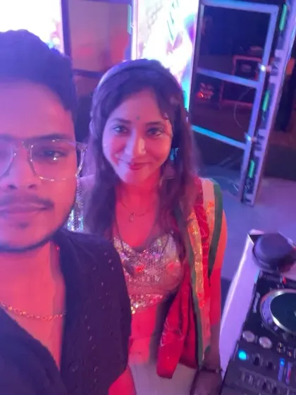 A quick selfie with a fellow artist next to the DJ booth during a Dandiya night.