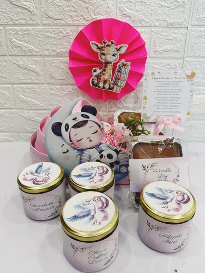 You can see the contents of the pram hamper here, including four beautifully decorated treat jars.