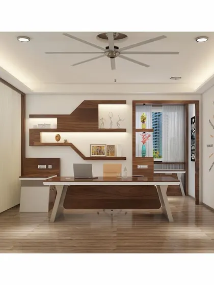 A director's cabin designed with a focus on warmth and inspiration. The space includes custom-built asymmetrical shelving with backlighting, a sleek desk, and a creative "IDEAS" word cloud graphic on the wall.